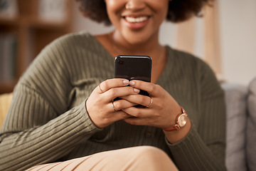 Image showing Hands, woman and typing with phone in home for social media post, online chat and reading notification. Closeup of female person relax with smartphone, download mobile games or search digital network