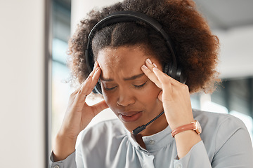 Image showing Woman, stress headache and call center in office, headphones and microphone for young crm with pain. African girl, customer care employee and fatigue for contact us, help desk and telemarketing job