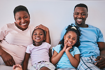 Image showing Black family, happy and portrait in a bed with smile, care and comfort on the weekend in their home. Face, love and children with parents in bedroom rest, embrace and relax in the morning together