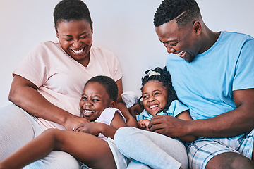 Image showing Happy, black family and tickle in a bed with smile, care and laugh on the weekend in their home. Bond, playing and children with parents in bedroom with games and having fun in the morning together