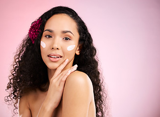 Image showing Skincare, cream and portrait of woman with flower in studio for wellness, facial treatment and cosmetics. Dermatology, spa and face of female person with anti aging product, moisturizer and lotion