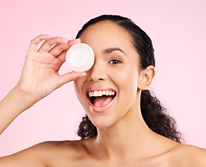 Image showing Face, skincare and excited woman with cream container in studio isolated on a pink background. Portrait, natural and happy model with lotion, sunscreen cosmetic and dermatology product for wellness