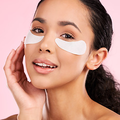 Image showing Eye patch, face mask and beauty of a woman with natural skin glow on a pink background. Dermatology, collagen and cosmetics portrait of female model for facial shine, wellness or self care in studio