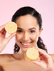 Image showing Woman, skincare and lemon in studio portrait for smile, happiness or natural skin glow by pink background. Mexican model and fruit for cosmetics, youth or detox for wellness, nutrition and shine