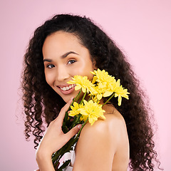 Image showing Flowers, face and skincare of happy woman in studio isolated on a pink background. Portrait, smile or beauty model with plant, floral cosmetics or natural organic treatment for healthy skin aesthetic