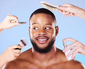 Image showing Self care, hands and man with beauty products in a studio for natural, face and grooming routine. Skincare, wellness and young male model with health and hygiene treatment isolated by blue background