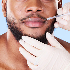 Image showing Man, plastic surgery and needle in studio for lips, filler and beauty for face transformation by background. African patient, model or surgeon hands for skincare, syringe or dermatology for aesthetic