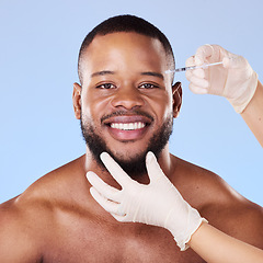 Image showing Needle, man and portrait for skincare, beauty process and filler in studio. Face of black male model, hands of surgeon and injection for plastic surgery, facial change and prp cosmetics on background