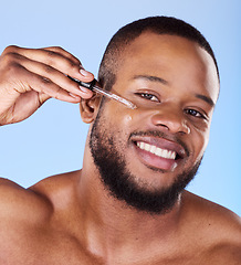 Image showing Black man, portrait and serum for face in studio, aesthetic skincare or dermatology on blue background. Happy male model, facial cosmetics and dropper of hyaluronic acid, collagen and oil for beauty