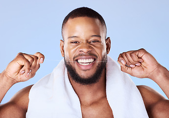 Image showing Portrait, man and floss teeth for smile, dental health and care for gum gingivitis in studio. Face of happy black male model, oral thread and cleaning mouth for fresh breath, tooth hygiene and beauty