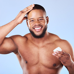 Image showing Health, portrait and a black man with cream for hair care, shine and moisture on a studio background. Happy, wellness and an African person or model with gel for growth isolated on a backdrop