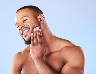 Image showing Cosmetics, cleaning and black man with skincare, muscle and grooming against a blue studio background. Male person, model and guy with treatment, shine and glow with dermatology, aesthetic and health