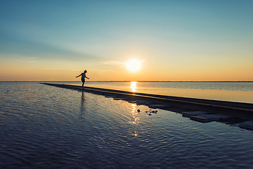 Image showing Boy on railway at beauty sunset