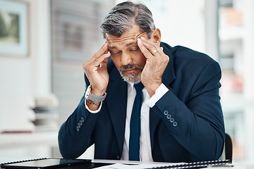 Image showing Headache, pain and business man in office for financial report, mistake or problem and career crisis with documents. Stress, tired or fatigue executive, CEO or corporate person in accounting or taxes