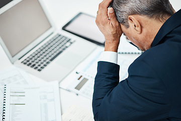 Image showing Headache, laptop and business man stress in financial crisis, report or stock market crash of documents review. Pain, frustrated or sad executive, CEO or person for online accounting or taxes mistake