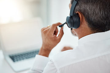 Image showing Back, call center and man listening for customer service, support and business with laptop. Contact us, telemarketing microphone and professional, sales agent and crm consultant working at help desk