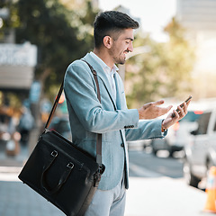 Image showing Phone, app and a business man in the city for travel on his morning commute into work during summer. Mobile, social media or networking with a happy young male employee on an urban street in town