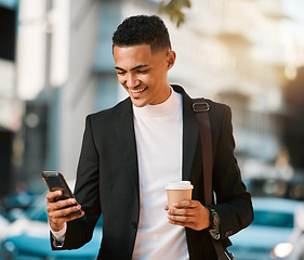 Image showing Business man, phone and texting in a city with social network and smile in the morning with commute. Happy, mobile networking and online app search with coffee and travel on urban street with typing