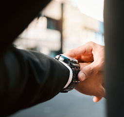 Image showing Hands, clock and time with business man in street, road with calendar date, schedule and notification. Entrepreneur, iot watch and check for reminder, closeup and reading in city, cbd or metro street