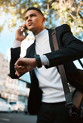 Image showing Business man, phone call and city with a watch, travel and contact with connection, check time and schedule. Entrepreneur, appointment or employee with a smartphone, talking and commute with deadline