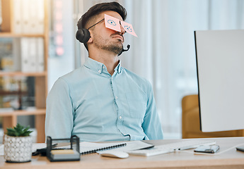 Image showing Tired, sleeping and business man with sticky notes on eyes from low energy and burnout in office. Fatigue, nap and rest of a male professional with drawing on glasses to pretend at a company