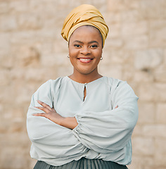 Image showing Portrait, smile and arms crossed with a business black woman standing outdoor in the city for management. Leadership, mindset and confidence with a happy female CEO, manager or boss in an urban town