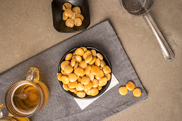 Image showing Tasty lupins and glass of beer