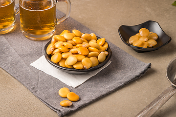 Image showing Tasty lupins and glass of beer