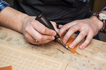 Image showing Concept of handmade craft production of leather goods.