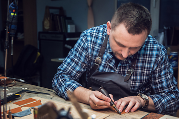 Image showing Concept of handmade craft production of leather goods.