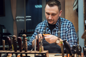 Image showing Concept of handmade craft production of leather goods.