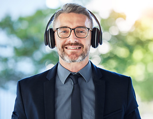 Image showing Face, mature and business man with headphones outdoor for music podcast. Portrait, accountant and happy ceo listening to radio, audio or hearing sound with smile for jazz, hip hop and song on bokeh.