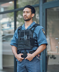 Image showing Security, police officer and man in uniform in city for defense, inspection and supervision on patrol. Surveillance, law enforcement and male person in town for safety, crime and protection service