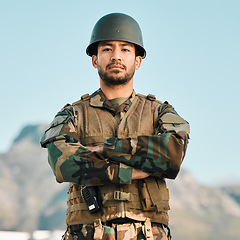 Image showing Portrait, soldier and asian man with arms crossed in city for power, confidence and mindset outdoor. War, military and face of Japanese guy warrior proud, hero or ready for army, security or training