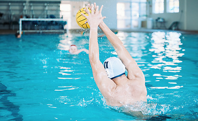 Image showing Sports, training and water polo with man in swimming pool for goal, fitness and games. Championship, workout and performance with person and ball in competition for health, wellness and target