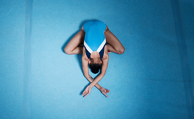 Image showing Top view, gymnast and woman stretching for performance on ground with mockup space. Sports, gymnastics and athlete training, dance and exercise for fitness, healthy body and wellness for workout