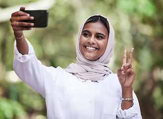 Image showing Selfie, peace sign and student with muslim woman in park for social media, relax and happy. College, smile and happiness with female person in nature for profile picture, blog and gen z post