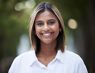 Image showing Portrait, smile and confident with a woman in nature, outdoor on a green background for travel or freedom. Face, happy and a carefree young female person standing in a park for fresh air or adventure