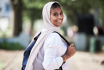 Image showing Hijab, student and portrait of woman on campus for university, school and college education happy to travel to class. Smile, Islam and young religious person walking to a lecture for learning