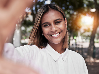 Image showing Girl, smile and selfie in outdoor in nature for travel or to relax with peace or style for social media. Happy, face and portrait with woman at park or influencer with freedom, positive or confident.