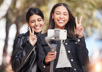 Image showing Wink, selfie and peace sign with friends in city for social media, happy and support. Happiness, profile picture and live streaming with women outdoor for internet, post and youth together