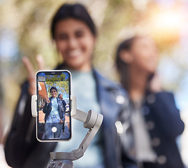 Image showing Portrait, friends and phone selfie with peace sign in city, smile and bond together outdoor. Smartphone, profile picture and girls or women with photography for happy memory, v emoji or social media