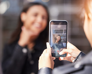 Image showing Woman, phone screen and photographer with smile, city and excited for video, post or update for social media. Influencer girl, friends and smartphone for thumbs up, live streaming or profile picture