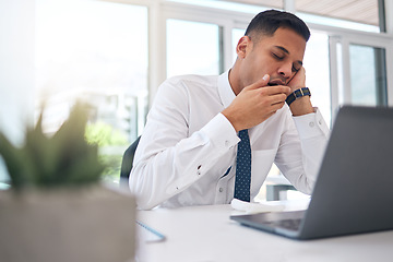 Image showing Tired, yawn and man at desk in office with burnout, stress problem or low energy while working on laptop. Fatigue, lazy and yawning business employee feeling overworked, bored and bad time management