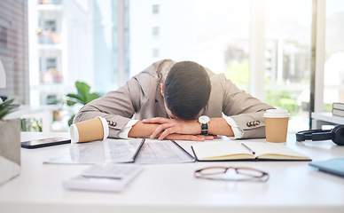 Image showing Tired business man sleeping at desk with burnout, stress problem and low energy in office. Fatigue, frustrated and sad male employee in nap for bad time management, deadline and depression of mistake