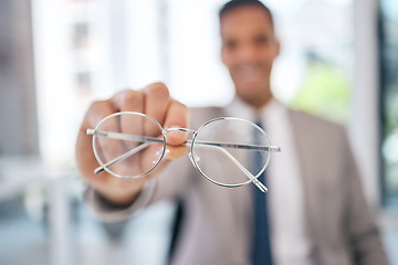 Image showing Professional, man and glasses in hand in closeup at corporate office with clear vision in blurry background. Lens, eye care and business man holding prescription for sight or maintenance.