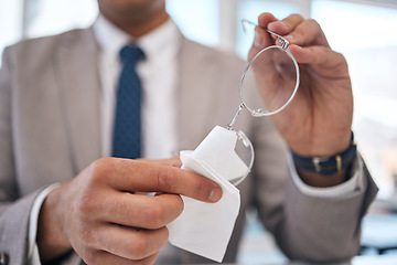 Image showing Lens, man and cleaning and glasses with hand or fabric in office to wipe dirt in blurry background. Professional, prescription and maintenance with cloth for person with eye care or clear vision.