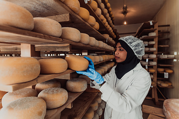 Image showing Arab investor in a warehouse of the cheese production industry