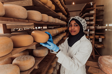 Image showing Arab investor in a warehouse of the cheese production industry