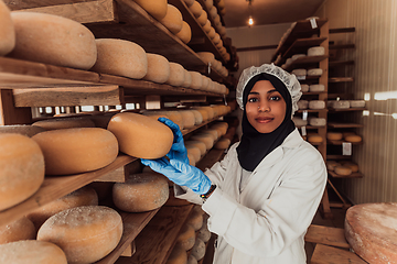 Image showing Arab investor in a warehouse of the cheese production industry